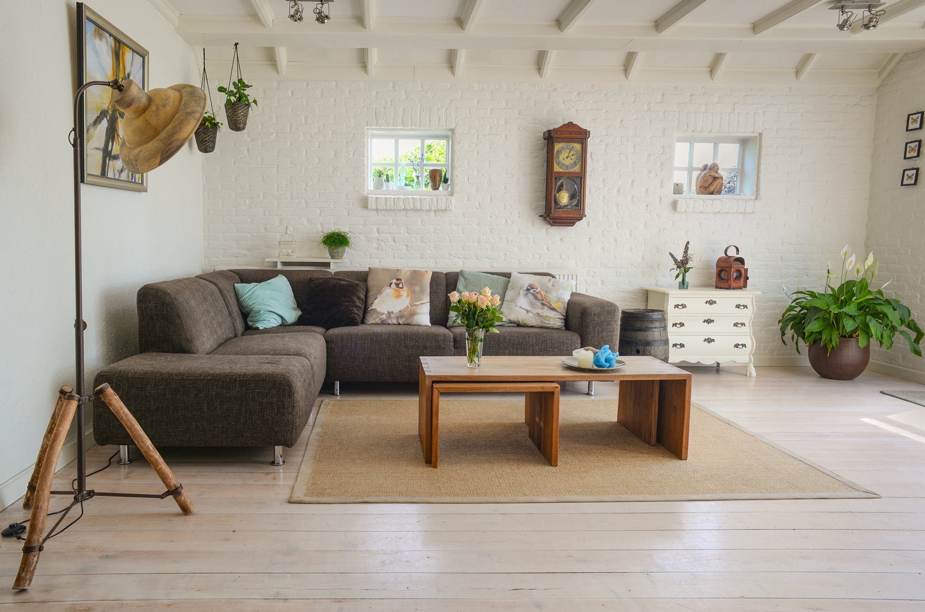 this is an photo of a living room with a corner sofa and a table 