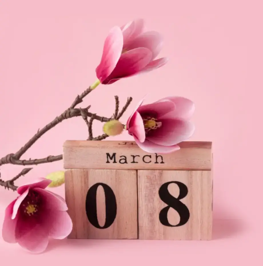  a wooden calendar showing March 8th, we spell date with an a